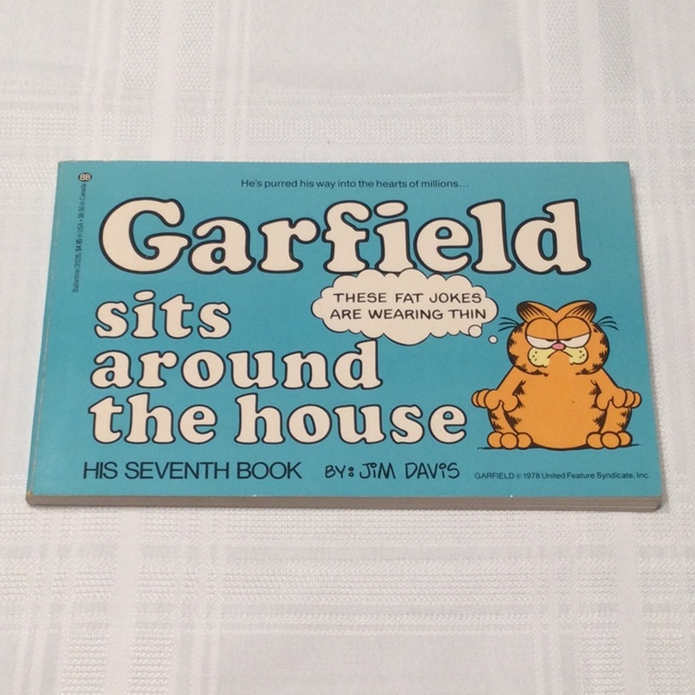 Garfield sits around the house by Jim Davis​